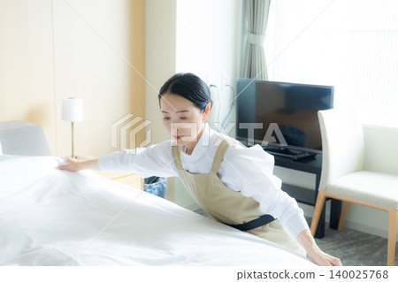 Middle-aged female cleaner Middle-aged female cleaner 140025768