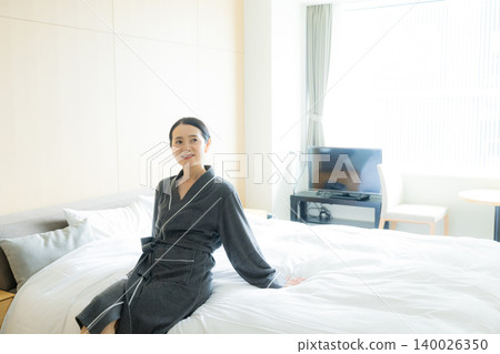 Middle-aged woman in a bathrobe Middle-aged woman in a bathrobe 140026350
