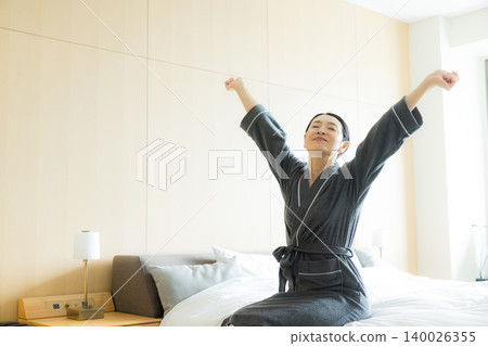 Middle-aged woman in a bathrobe Middle-aged woman in a bathrobe 140026355