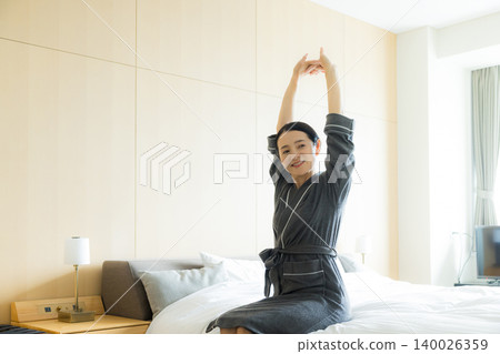 Middle-aged woman in a bathrobe Middle-aged woman in a bathrobe 140026359