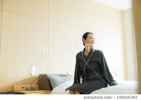 Middle-aged woman in a bathrobe Middle-aged woman in a bathrobe 140026365