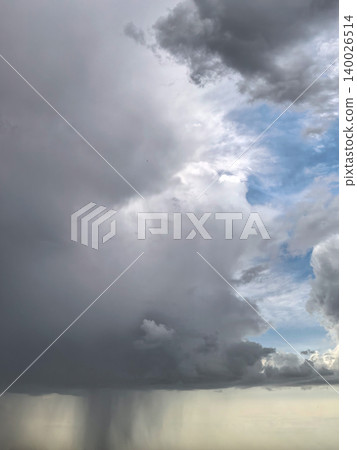 Dark Thundercloud With Rain Shaft And Blue Sky 140026514