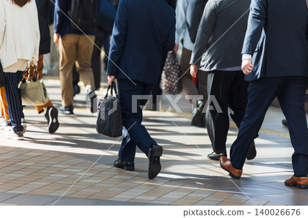 The feet of a young businessman from behind 140026676