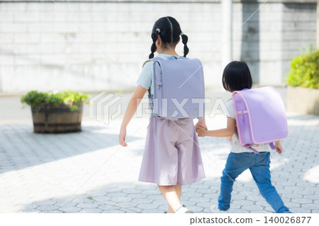 Girls playing in the park Girls playing in the park 140026877