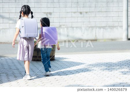 Girls playing in the park 140026879