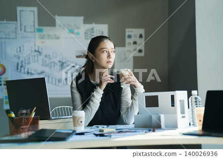 A woman working at a design firm A woman working at a design firm 140026936