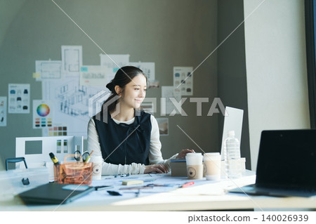 A woman working at a design firm A woman working at a design firm 140026939