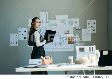 A woman working at a design firm A woman working at a design firm 140027014