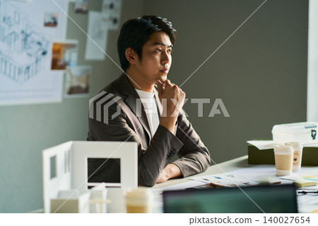 A male chief designer brainstorming ideas. 140027654