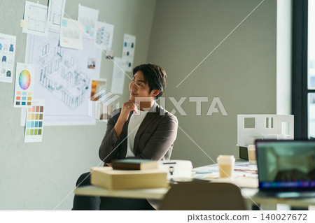 A male chief designer brainstorming ideas. 140027672