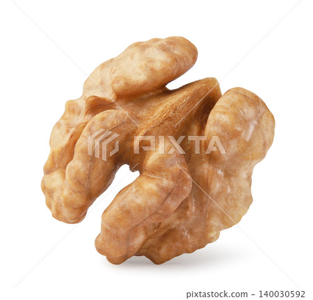 Walnut kernel stands on a white background. Isolated Walnut kernel stands on a white background. Isolated 140030592
