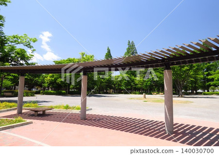 A park scene in a residential area on a summer morning with a terrace. A park scene in a residential area on a summer morning with a terrace. 140030700