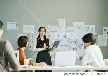 Female designer proposing ideas Female designer proposing ideas 140030744