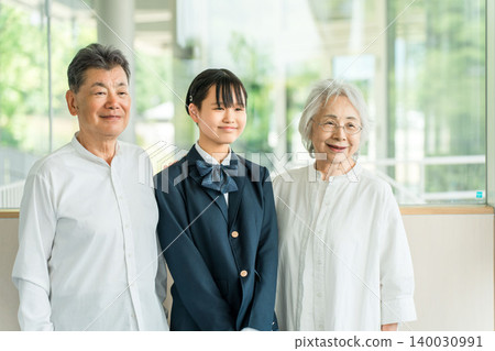 Smiling grandparents and their middle school and high school grandchildren, family. Smiling grandparents and their middle school and high school grandchildren, family. 140030991