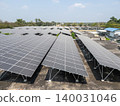 Aerial View of Commercial Rooftop Solar Panel Array at Industrial Facility 140031046