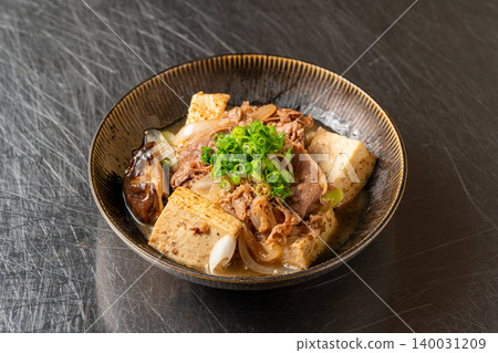 Sukiyaki Meat and Tofu: A Japanese-style stew infused with the rich flavor of beef. Sukiyaki Meat and Tofu: A Japanese-style stew infused with the rich flavor of beef. 140031209