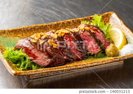 Seared beef skirt steak: A juicy beef skirt steak dish with a fragrant seared aroma. Seared beef skirt steak: A juicy beef skirt steak dish with a fragrant seared aroma. 140031213