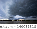 Storm Clouds Gathering Over Chao Phraya River In Chai Nat. Dramatic dark clouds forming over the river landscape in Thailand, perfect for weather, nature and climate change themes. 140031318