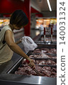 Woman Picking Goods From A Shelf At Shopping Counter, female consumer choosing products for retail store marketing campaign, brand awareness, grocery supermarket commerce and buyer lifestyle. 140031324