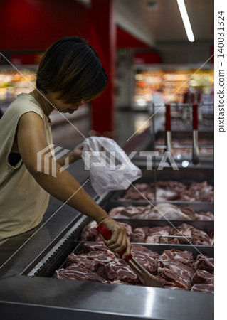 Woman Picking Goods From A Shelf At Shopping Counter, female consumer choosing products for retail store marketing campaign, brand awareness, grocery supermarket commerce and buyer lifestyle. Woman Picking Goods From A Shelf At Shopping Counter, female consumer choosing products for retail store marketing campaign, brand awareness, grocery supermarket commerce and buyer lifestyle. 140031324