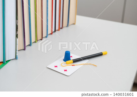 Magic trick setup with wand and levitation card on table Magic trick setup with wand and levitation card on table 140031601