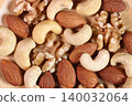 Close-up of mixed nuts served on a plate 140032064
