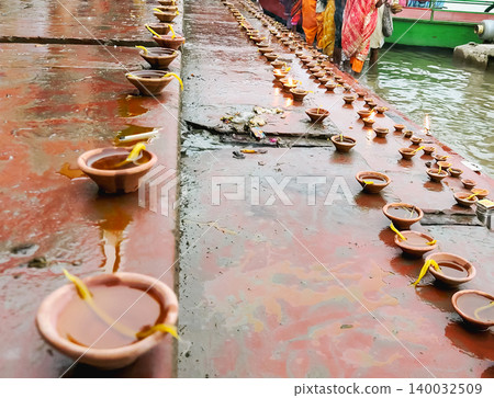 Oil Lamps (Diyas) Lined Along River Ghat During Ritual in Mathura Oil Lamps (Diyas) Lined Along River Ghat During Ritual in Mathura 140032509