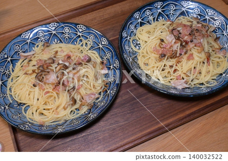 A hearty peperoncino pasta with octopus and shimeji mushrooms. 140032522