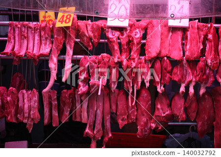 Pork sold at a butcher shop in the Hong Kong market. Higher and more expensive than beef and chicken. Chinese love pork Pork sold at a butcher shop in the Hong Kong market. Higher and more expensive than beef and chicken. Chinese love pork 140032792
