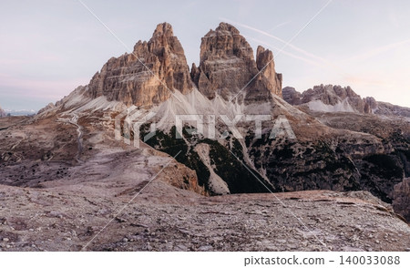 The sunlight covers the rocks. Tre Cime di Lavaredo mountains, majestic view of the popular place, nature background The sunlight covers the rocks. Tre Cime di Lavaredo mountains, majestic view of the popular place, nature background 140033088