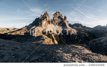 The sunlight covers the rocks. Tre Cime di Lavaredo mountains, majestic view of the popular place, nature background The sunlight covers the rocks. Tre Cime di Lavaredo mountains, majestic view of the popular place, nature background 140033089