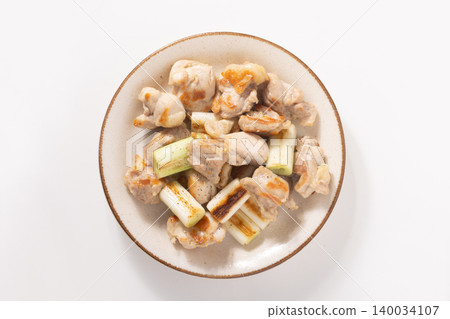 Grilled chicken thigh with green onion and salt Grilled chicken thigh with green onion and salt 140034107