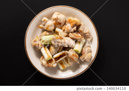 Grilled chicken thigh with green onion and salt Grilled chicken thigh with green onion and salt 140034110