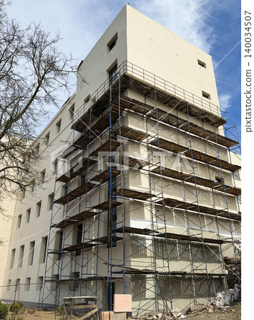 Building construction site with scaffolding Building construction site with scaffolding 140034507