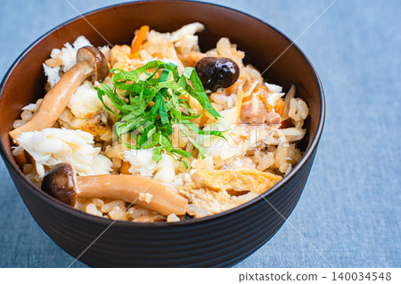 Photo of Japanese-style mixed rice with sea bream, mushrooms, and perilla leaves. Photo of Japanese-style mixed rice with sea bream, mushrooms, and perilla leaves. 140034548