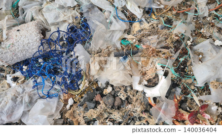 Plastic waste and microplastics cover the beach, causing severe ecological damage to marine life and coastlines Plastic waste and microplastics cover the beach, causing severe ecological damage to marine life and coastlines 140036404