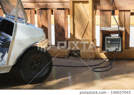 Charging an electric golf car at home Charging an electric golf car at home 140037045