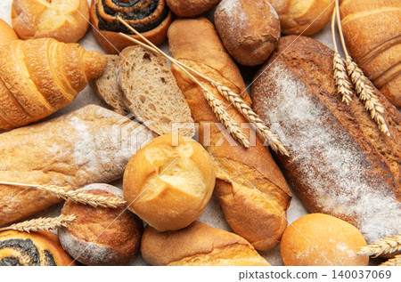 Variety of fresh baked bread, pastry, and wheat ears Variety of fresh baked bread, pastry, and wheat ears 140037069
