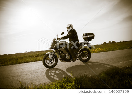 Biker on the road Biker on the road 140037599