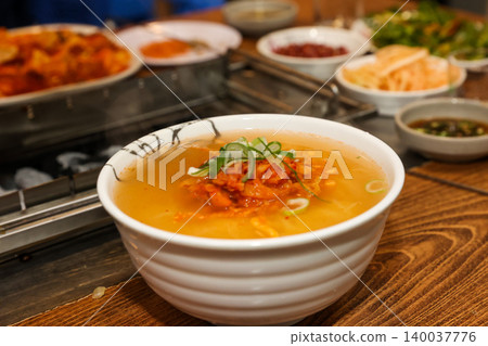 Bowl of Spicy Corn Noodle Soup at Asian Barbecue Restaurant 140037776