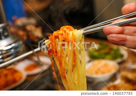 Bowl of Spicy Corn Noodle Soup at Asian Barbecue Restaurant 140037785