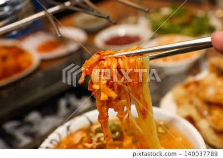 Bowl of Spicy Corn Noodle Soup at Asian Barbecue Restaurant 140037789