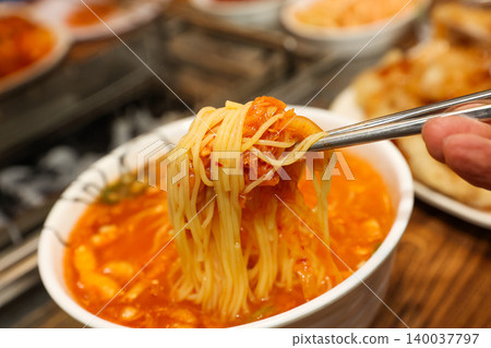 Bowl of Spicy Corn Noodle Soup at Asian Barbecue Restaurant Bowl of Spicy Corn Noodle Soup at Asian Barbecue Restaurant 140037797