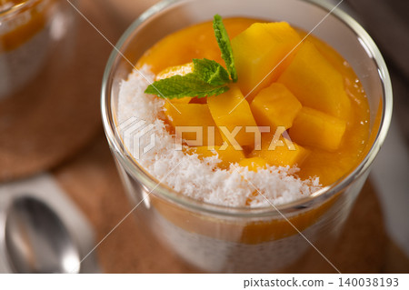 Mango Chia Seed Pudding with Coconut and Fresh Mint in a Glass 140038193