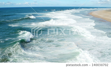 Beach with Waves in Nazare, Portugal 140038702