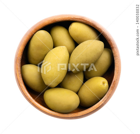 Cerignola olives with pits, in a wooden bowl. Known as Bella di Cerignola, whole, large premium Italian table olives, picked when they are still unripe, and then preserved in salt vinegar brine. Photo Cerignola olives with pits, in a wooden bowl. Known as Bella di Cerignola, whole, large premium Italian table olives, picked when they are still unripe, and then preserved in salt vinegar brine. Photo 140038832