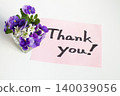 Thank you in handwritten letters and small flowers 140039056