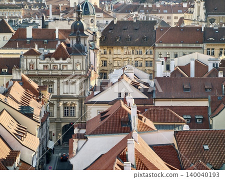 Chimneys roof view. Climb through narrow city rooftops featuring chimneys and historic dormers Chimneys roof view. Climb through narrow city rooftops featuring chimneys and historic dormers 140040193