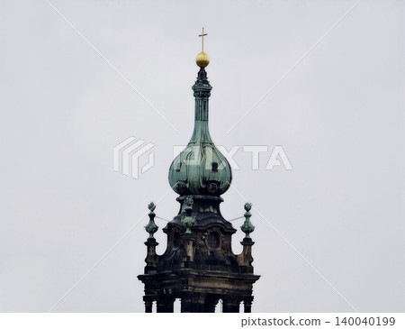 Artistic architecture details. Historic building featuring elaborate goldtopped dome and carved accents Artistic architecture details. Historic building featuring elaborate goldtopped dome and carved accents 140040199