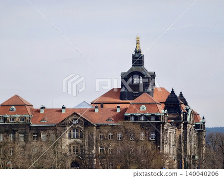 An historic urban school or university building showcasing clock tower and decorative architectural features An historic urban school or university building showcasing clock tower and decorative architectural features 140040206